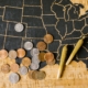 A USA map with cannabis joints and coins, symbolizing legal marijuana and its economic impact.