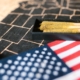 Cannabis joints in a tray with an American flag on a map background.